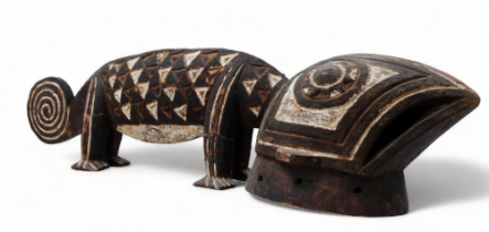 An African carved hardwood polychrome painted gecko - length 90cm.