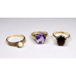 A 9ct gold amethyst set ring - the oval stone within a pierced claw setting, ring size L, weight 3.