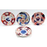 An early 20th century Japanese Imari pattern plate - with scalloped rim, diameter 22cm, together