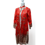 A Chinese red silk gown - decorated with gold wire showing figures, pagodas, landscape and clouds,