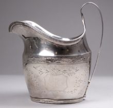 A silver helmet shaped cream jug - London 1795, with reeded handle and bright-cut foliate engraving,