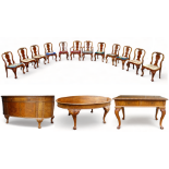 An early 20th century German burr walnut dining suite - in George II style, comprising an