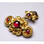 A Victorian gilt metal memorial brooch - of foliate design set with cabochon red stones, weight 6.