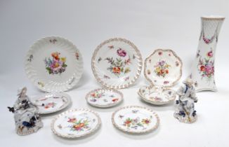 An early 20th century Nymphenburg dessert plate - of spiral fluted form and decorated with floral