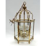 A Georgian style brass hexagonal hall lantern - height 59cm.