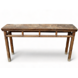 A late 19th century Chinese hardwood altar table - the rectangular top above an open frieze on