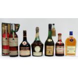 A bottle of St Remy brandy - together with a half bottle of Courvoisier cognac, a bottle of Sandeman