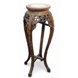 A late 19th century Chinese hardwood and marble jardiniere stand - the circular top with cherry