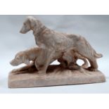 A late 19th century Parian sculpture - modelled as two hunting dogs standing in an alert position,