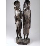 An East African carving of a Maasai warrior and woman - height 38cm.