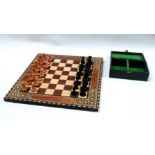 A mid 20th century Staunton chess set - turned boxwood in natural and ebonised sides, king height