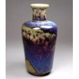 A Ruskin Pottery high-fired stoneware vase - of shouldered cylindrical form with narrow neck,