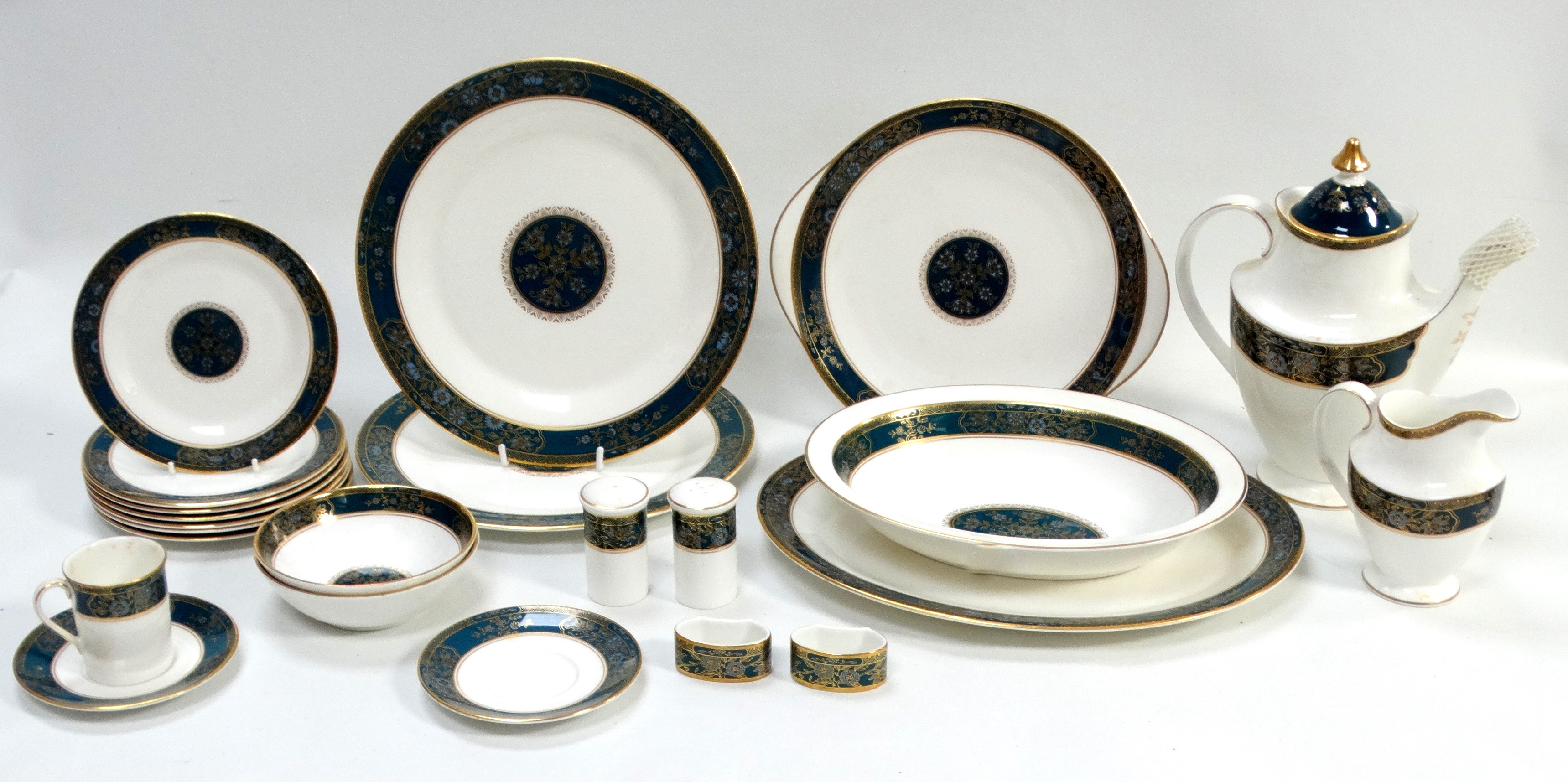 A Royal Doulton 'Carlyle' pattern part dinner service - comprising a coffee pot, two napkin rings,