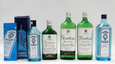 A bottle of Gordon's gin - 1 litre, together with another similar, a litre bottle of Bombay Sapphire