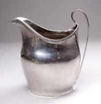 A George III silver helmet shaped cream jug - London 1807, William Hunter II, with reeded handle and