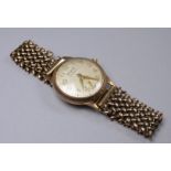 A Baume 9ct gold cased gentleman's wristwatch - the cream dial set out in Arabic numerals with a