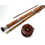 An early 20th century cane fishing rod - three sections with black whipping, together with a