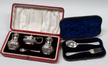 A silver three piece cruet set - Birmingham 1903, of part gadrooned baluster form, boxed, together