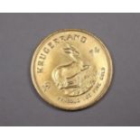 A South African Kruggerand, dated 1974. '1oz FINE GOLD'.