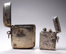 A silver lighter - with foliate engraving and vacant shield cartouche, Birmingham 1910, William