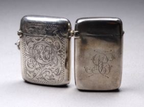 A silver vesta case with foliate engraving - Birmingham 1919, Henry Williamson Ltd, together with