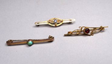 A 9ct gold bar brooch - set with a red stone, a 9ct gold pearl set bar brooch and another 9ct gold