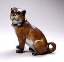 A late 19th century German porcelain model of a pug - after Meissen, seated on its haunches with