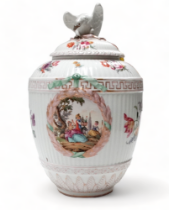 An early 20th century Meissen vase and cover - decorated with floral sprigs and vignettes of