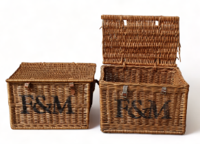 A pair of Fortnum & Mason wicker hampers, each with stencilled logo, each length 57cm, depth 38cm,