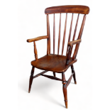 A late 19th century ash and elm Windsor style chair - with a top rail and stick back above arms