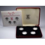 A Royal Mint 1984-1987 silver proof collection - the four one pound coins within capsules, limited