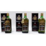 A bottle of Bells twelve year old whisky - boxed, together with two further similar bottles. (3)