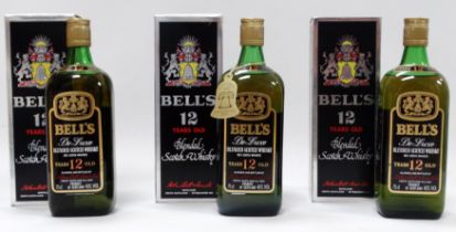 A bottle of Bells twelve year old whisky - boxed, together with two further similar bottles. (3)