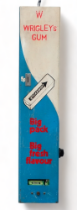 A Wrigley's vending machine - 5p in the slot, wall mounted in cream, blue and red colourway, width