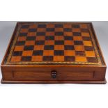 A mid 19th century draughts board - with a walnut carcass and rosewood/satinwood squares within