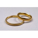 A 22ct gold wedding band - size R/S, weight 2.8g, together with another 22ct gold band, size H/I,