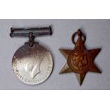 A WWII George VI medal - together with a 1939-45 star medal.