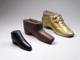 An early 20th century brass inkwell in the form of a shoe - traces of silver plating, length 14cm,