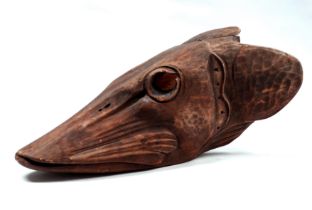 An Indonesian carved hardwood mask in the form of a fish - length 47cm.