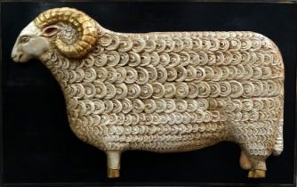 A carved bas relief wooden ram with gilt horns and hooves - mounted on a board, width 123cm,