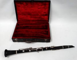 An early 20th century ebony clarinet by Boosey & Hawkes - with nickel fittings, in a case for two
