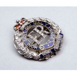 A diamond set sweetheart brooch - Royal Engineers, in the form of a wreath incorporating a blue