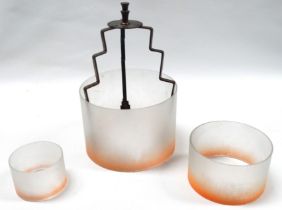 An Art Deco style hanging ceiling lamp - of three graduated graded orange opaque glass rings