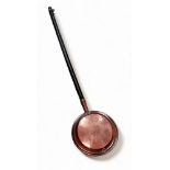A Victorian copper warming pan - the cover with punched star decoration, length 115cm.