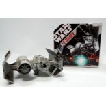 A Hasbro Star Wars Tie Bomber - boxed with pilot and three bombs.