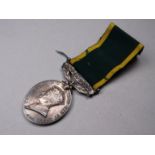 A George VI Territorial Efficiency medallion.