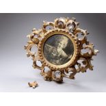 An early 20th gilt Florentine frame - circular of foliate form with an easel back, diameter 16cm.