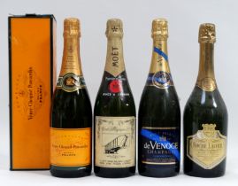 A bottle of Veuve Clicquot champagne - boxed, together with three further bottles of champagne