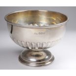 A small silver rose bowl - Sheffield 1929, Walker & Hall, part reeded and raised on a circular foot,