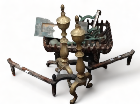 A pair of 19th century brass fire dogs - together with a grate, a further pair of dogs, a brass